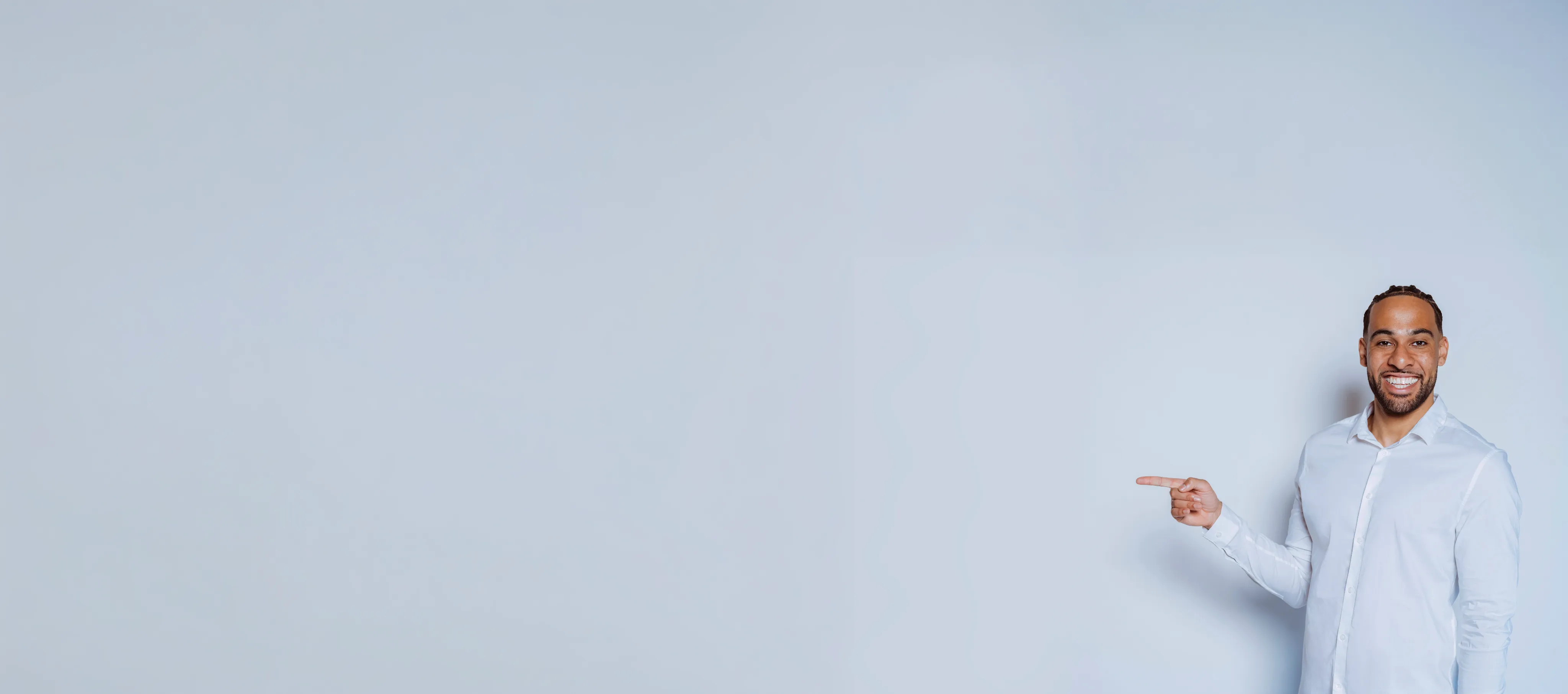 Friendly man pointing toward membership FAQ answers